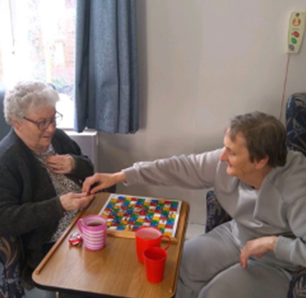 Residents taking part in games and friendly competition at Cross Way Care Home