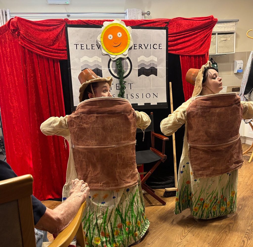 Entertainers performing for residents at Woodlands Care Home