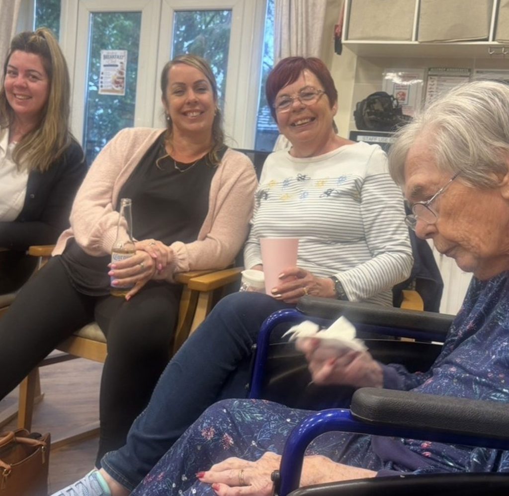 Residents and families taking part in the Wednesday evening pub quiz at Woodlands